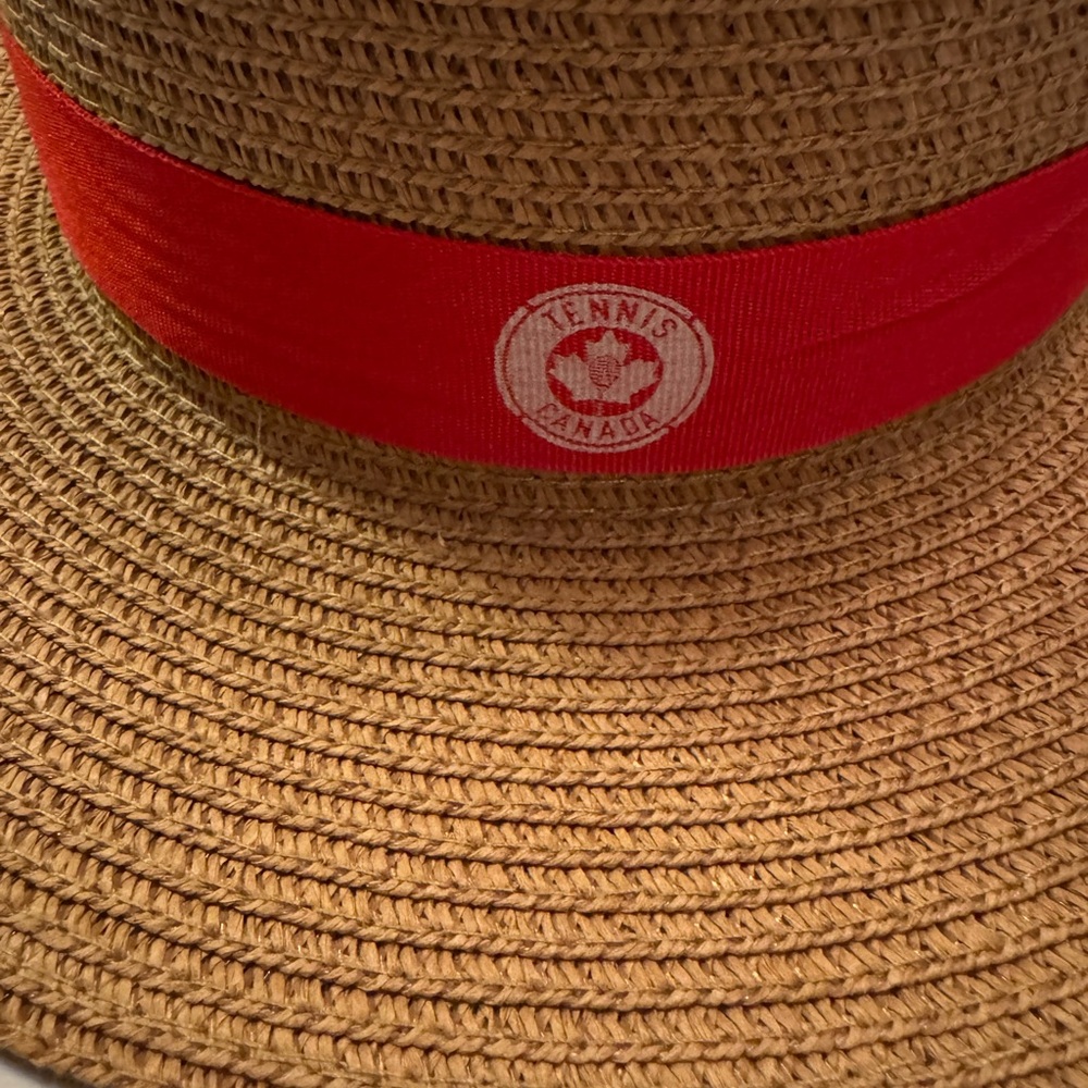 Tennis Canada brand women’s straw hat with red band.